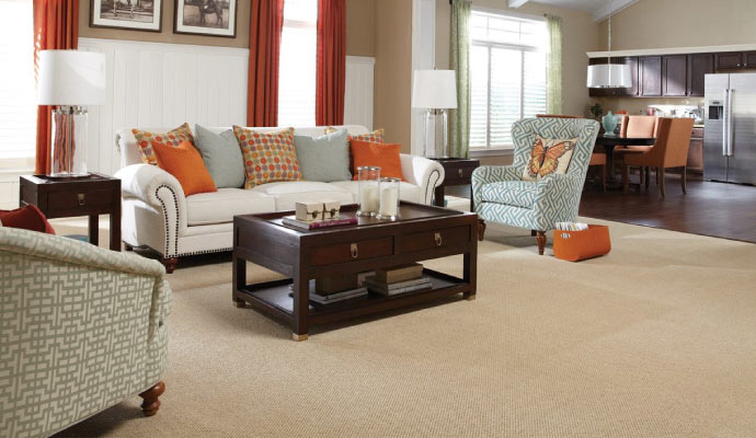 a living room with a fresh carpet installed on the floor