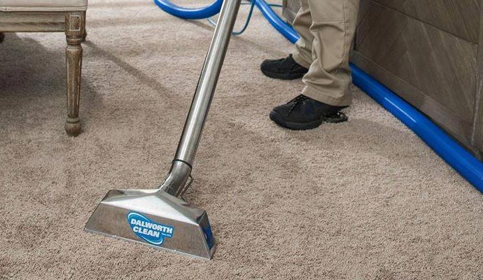 Professional carpet cleaning with vacuum cleaner