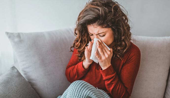 A woman facing allergies from the carpet