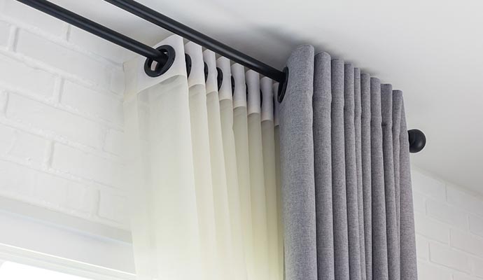 clean draperies installed in a house