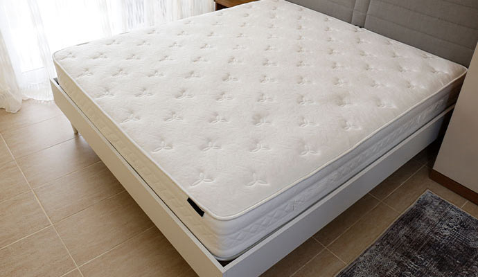 Clean mattress on the bed