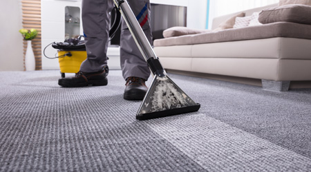 gray carpet cleaning using a machine